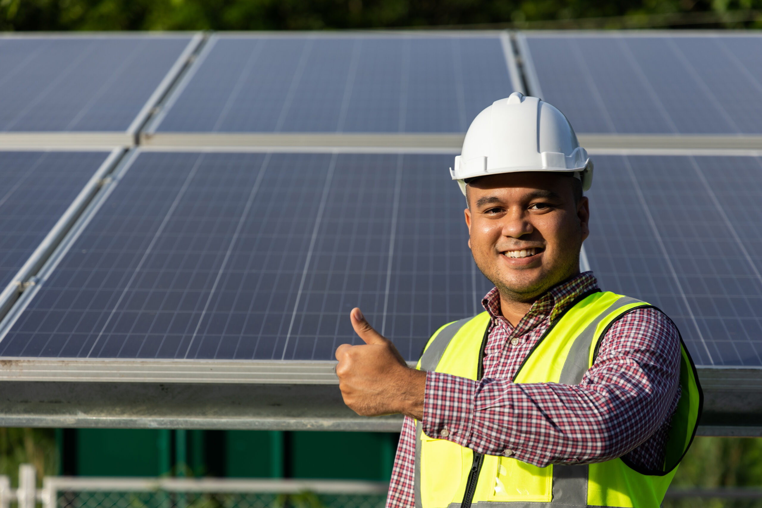 young asian electrical engineer standing front solar cell panels farm he showing thumbs up solar genera scaled